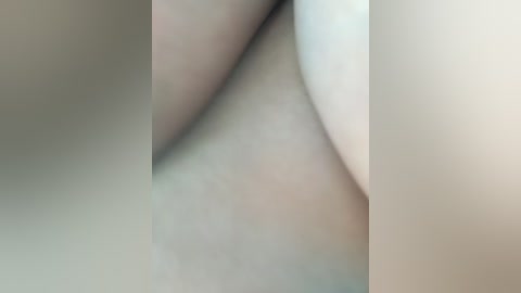 Video of abstract, soft-focus, white and beige abstract shapes, creating a minimalist, serene aesthetic with no discernible objects or people.