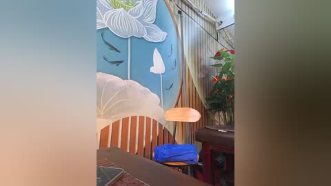 A video of a whimsical, brightly lit room with a blue wall featuring a large white flower, a white umbrella, and a white bird. The room includes a wooden chair, a potted plant, and a warm-toned lamp.