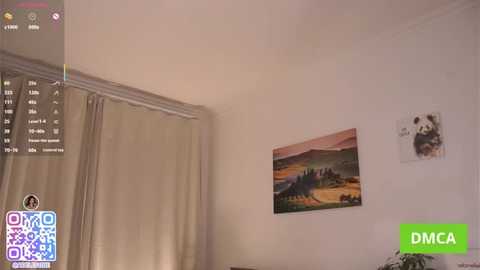 A video of a minimalist bedroom with beige curtains, a landscape painting, and a green DMC QR code on the wall.