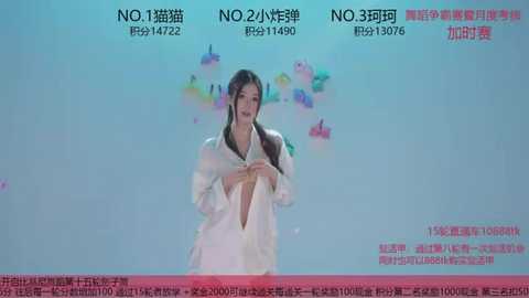 Video of a Chinese woman with long black hair, wearing a white lab coat, speaking into a microphone on a stage with a blue and pink backdrop. Text in Chinese and English.