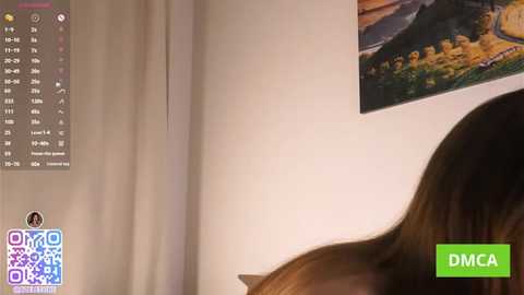 A video shows a close-up of a woman's head with brown hair, partially cropped, next to a calendar and a framed painting on a cream wall. The image also includes a green \"DMCA\" watermark.