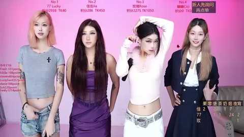 Media: Video of four East Asian women with different hair colors, wearing diverse, colorful outfits. Background features a pink wall with text and Chinese characters.
