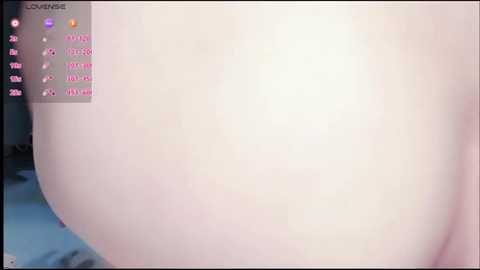A close-up video of a pale, smooth-skinned, large buttock, possibly from a live-streaming video game interface, featuring a user's stats on the left side.