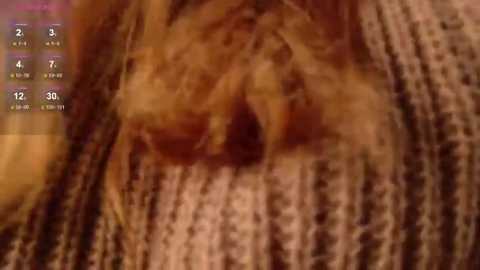 Video of a close-up view of a person's mouth, showcasing a large, dark, hairy mole located centrally, surrounded by textured, brownish skin. The image is blurry, with a greenish background.