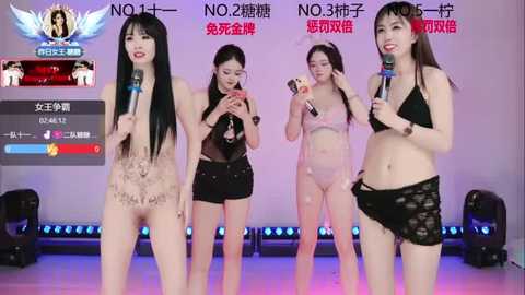 Video of four East Asian women in lingerie on stage, holding microphones, with audience voting screens in the background.