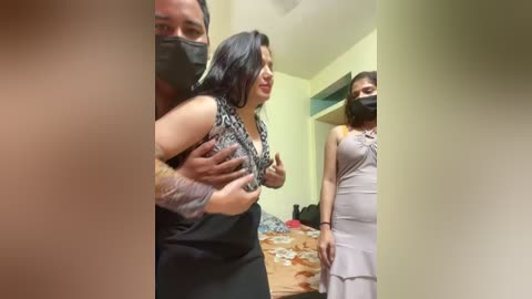 Video: A middle-aged woman with medium skin tone, wearing a black and white patterned top and black skirt, is forcefully held by two men in a dimly lit room.