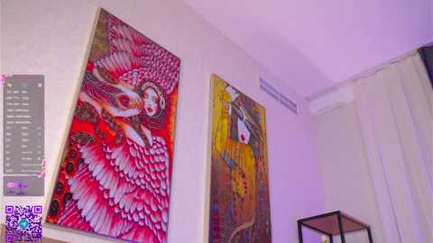 Video of a modern art gallery featuring two vibrant, abstract paintings. One depicts a winged figure with pink and white feathers, while the other showcases a surreal face with red and yellow hues. A QR code and a digital display are visible.