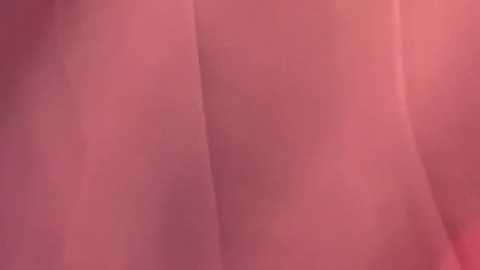 Close-up video of a person's thigh, showing smooth, light skin with a slight pinkish hue. The texture appears soft and the skin is unblemished. The focus is on the upper thigh, with no clothing visible.