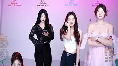 Video of four young East Asian women in a studio. Three wear black lace tops, one a white sleeveless top, all with different facial expressions and poses.