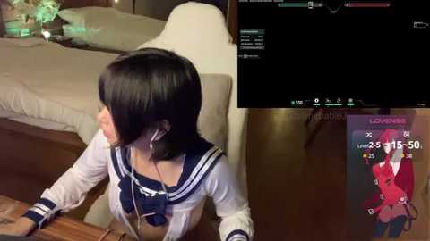 Video of a woman in a schoolgirl uniform, sitting at a desk, with a gaming screen displaying \"League of Legends\" in the background.