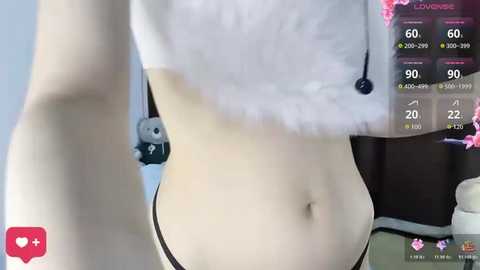 A video of a fair-skinned woman wearing a white crop top and black panties, with a blue stuffed animal and a virtual camera overlay.