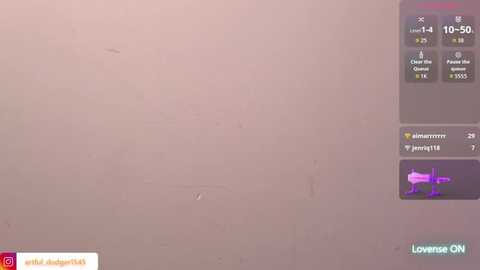 Video of a pale beige wall with a small purple smudge, overlaid with a YouTube video thumbnail featuring a purple arrow and text \"Lowenise.\