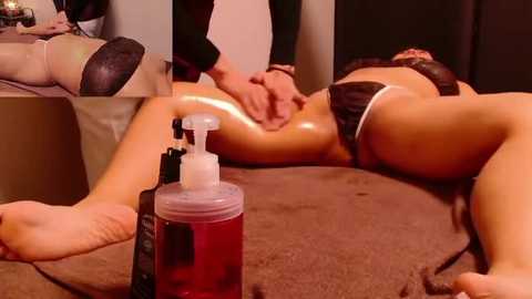 Video of a nude woman lying face down on a massage table, receiving a massage from a therapist. The woman has a light tan complexion, and the therapist's hands are visible massaging her back.