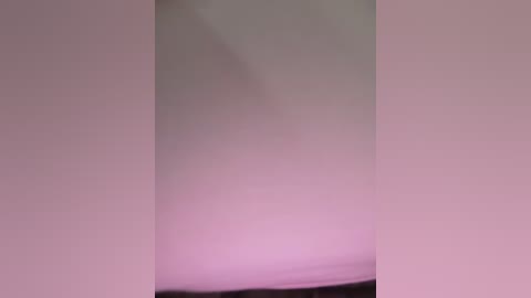 Media: A video featuring a blurred, abstract image with soft pastel colors of pink and purple, creating a dreamy and ethereal atmosphere. The image lacks discernible objects or figures, emphasizing a sense of mystery and fluidity.