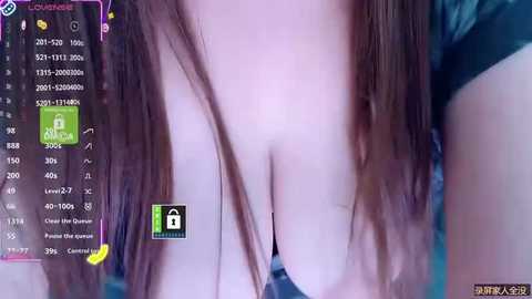 A close-up video of a light-skinned woman with long, straight brown hair, partially covering her breasts. The background features a computer screen displaying multiple open windows, including a green lock icon.