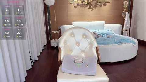 A video of a modern, minimalist bedroom featuring a plush white bed with light blue sheets, a transparent, circular light, and a virtual reality headset on a table.