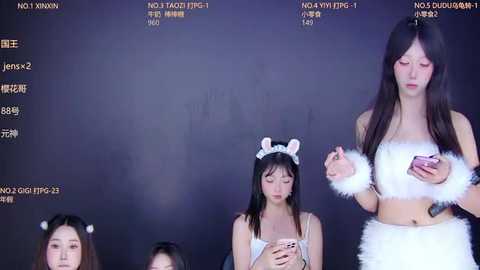 Video of an Asian woman in a white, fluffy, cat-themed outfit holding a phone, standing in front of a dark background with statistics and text in Chinese.