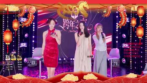 Video of four Asian women on stage in traditional Chinese attire, singing, surrounded by festive decorations, red lanterns, and dragon motifs.
