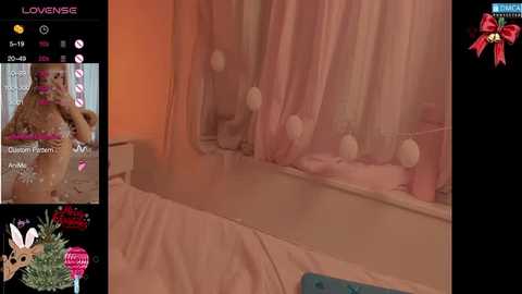 Video of a pink-themed bedroom with soft, pastel colors, featuring a teddy bear and a child's toy.