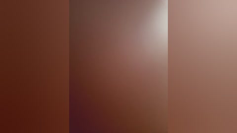 Media: A digitally rendered abstract image features soft gradients of warm brown hues, with a subtle light source creating a shadowy effect, suggesting depth and texture. The image lacks distinct objects or figures, emphasizing a minimalist, geometric aesthetic.