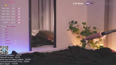 A video shows a person using a vibrator on a bed with a black sheet, surrounded by soft, ambient lighting and green plants. Text overlays indicate \"Grat Rate: 100%\" and mentions \"1000+ views.\