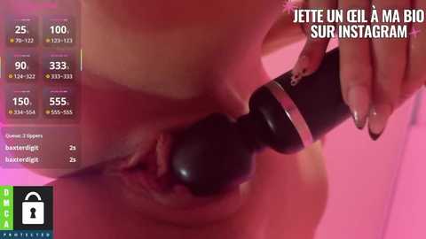 Video of a woman's vagina being massaged with a black vibrator. Text in French reads \"Jette un gil \u00e0 ma big sur Instagram.\
