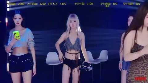 Video of three Asian women in a dimly lit club: one in a crop top and shorts, another in a leopard print dress, and a third in a silver crop top and black shorts.