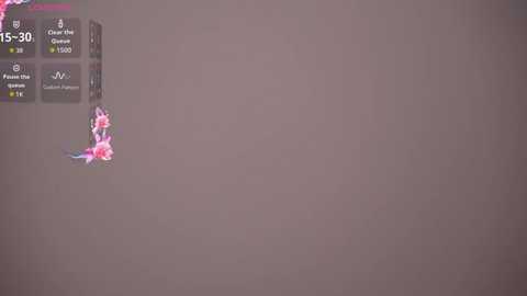 A video of a digital interface with a muted brown background. The screen displays a game with pink and blue flowers and text indicating \"15:30\" and \"Clan: 3, 3500, 1500.\