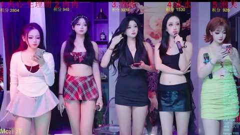 Video of five Asian women, each holding a phone, posing in a nightclub. They wear revealing, colorful outfits; background shows a dimly lit bar.