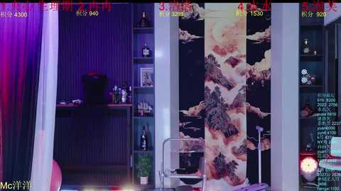 Video of a modern living room with a large, abstract painting featuring a mountainous landscape on a vertical wall. The room includes a bookshelf, wine bottles, and a glass table.