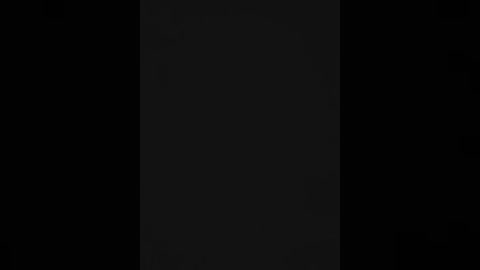 A black and white video of a vertical rectangle, divided into three equal sections, with the center section darker than the outer ones, creating a gradient effect.