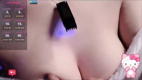 A close-up video of a pale, naked person's back, with a black vibrator inserted. A live streaming video overlay displays the \"Lovelive! School Idol Festival\" game.