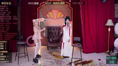 Media: Video of a chaotic scene with two women in revealing costumes, confetti scattered on the floor, and a red curtain backdrop.