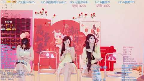 A vibrant video of three young women in casual summer outfits, sitting on stools, smiling, in a brightly lit room with colorful decorations and promotional posters.