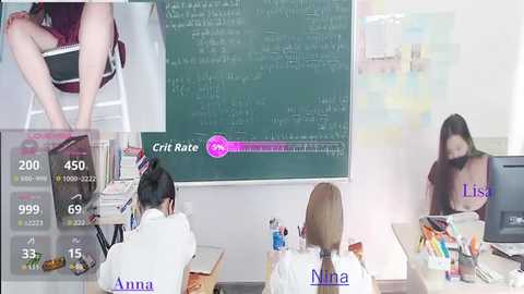 Video of two women in a classroom, one with long black hair in a white top and the other with long brown hair in a white top, both facing a chalkboard filled with equations.