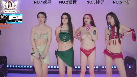 Video of four Asian women in provocative, colorful lingerie singing on stage.